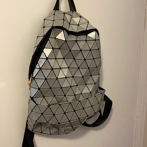 Unique and funky light back pack. Black and silver
